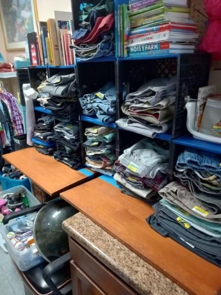 A round rack full of donated clothing.
