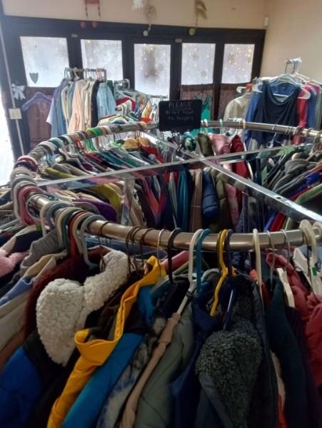 Racks of donated coats and jackets.