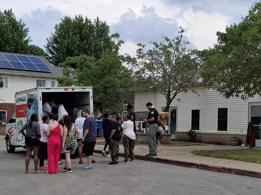 Neighbors receiving supplies at the relief delivery.