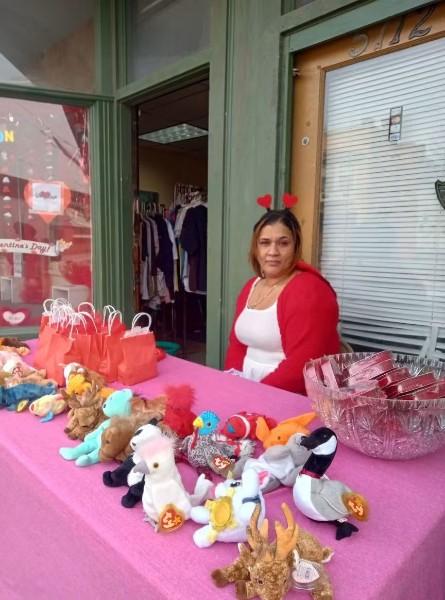 Tia with gift bags during a Valentine's Day giveaway.